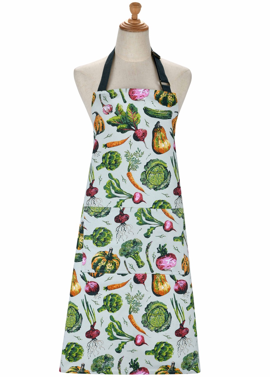 Küchenschürze aus Baumwolle, bedruckt mit einem bunten Allover-Muster aus illustriertem Gemüse wie Kürbis, Rote Beete & Co. im botanischen Stil