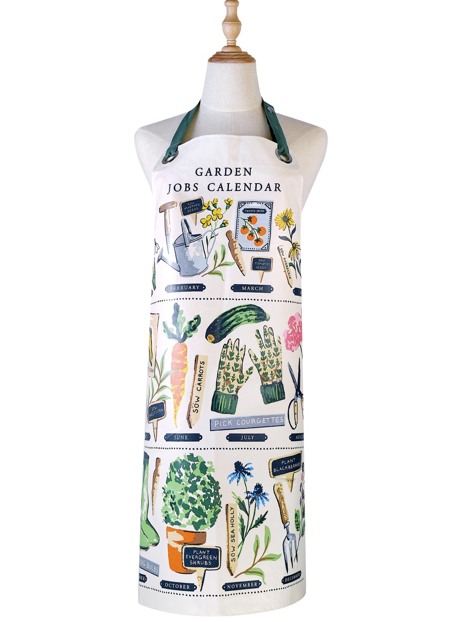 Wachstuchschürze | Das Design ist in zarten Aquarelltönen handgemalt und zeigt Vintage-Gartengeräte, Samentütchen und Gemüse auf weißem Hintergrund