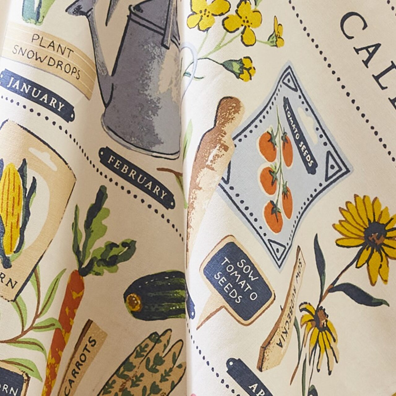 Detailansicht des Ulster Weavers Geschirrtuchs aus 100% Baumwolle | Illustrierter Jahresplaner für Gartenarbeiten mit botanischen Motiven